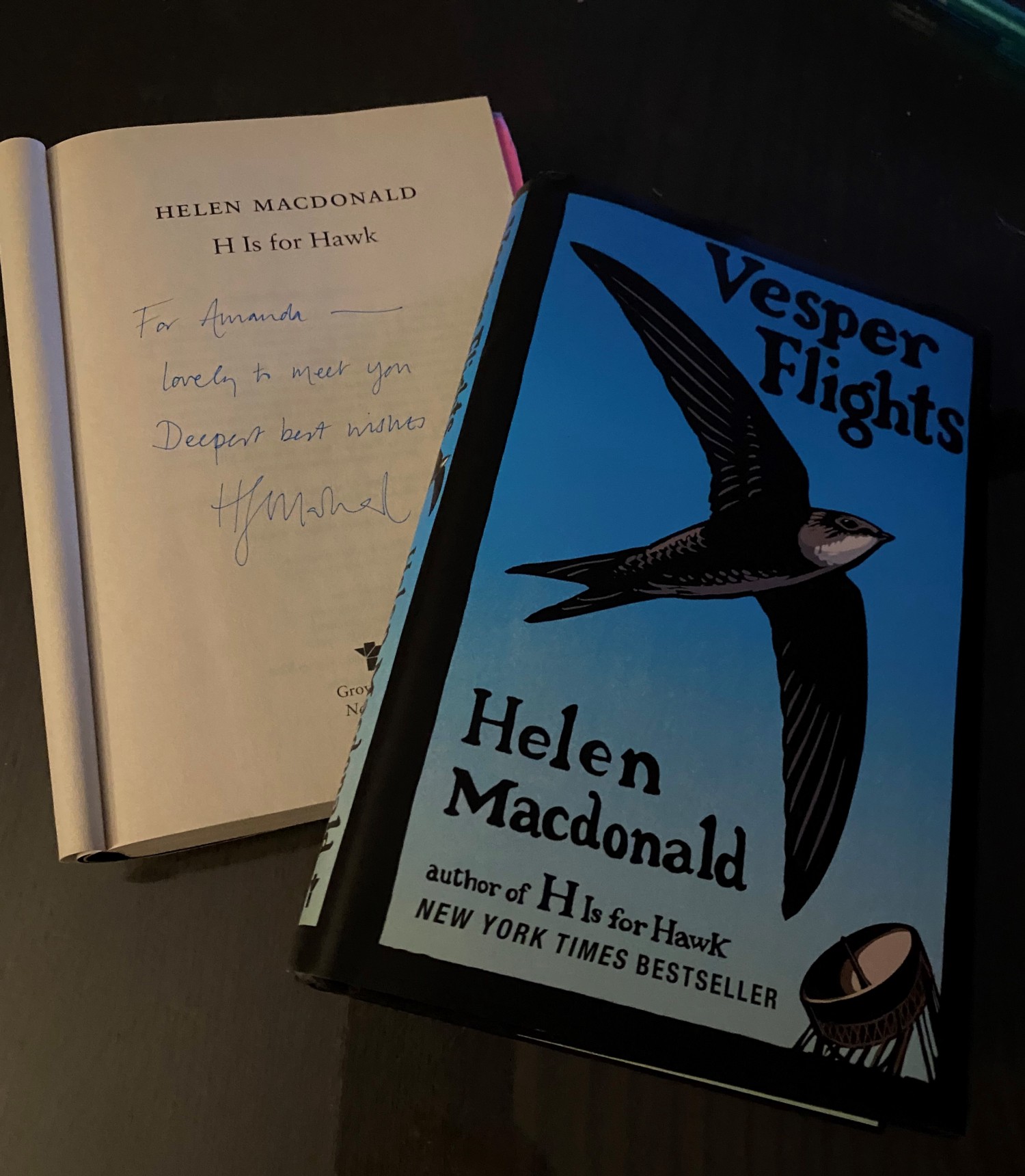 Vesper Flights by Helen Macdonald and an open H is for Hawk and signed by the author